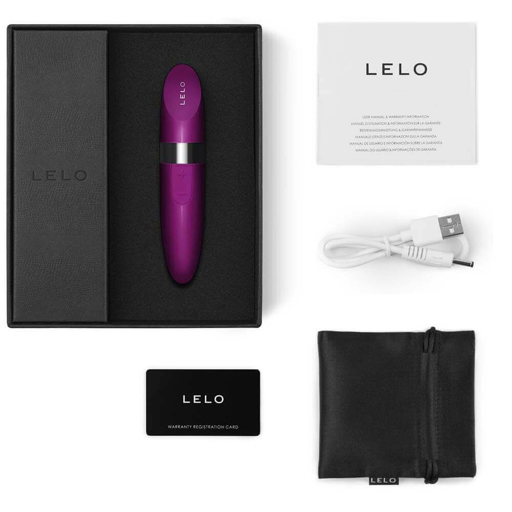 LELO Mia 2 vibrator, packaging includes USB charger, warranty registration card, storage pouch, and instruction manual.